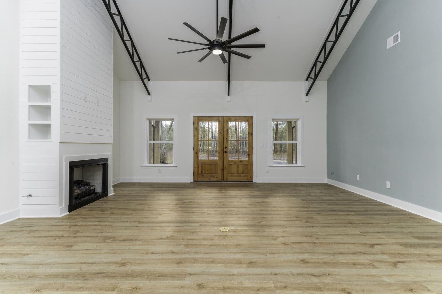 A completed 757 Building Co. great room with exposed trusses
